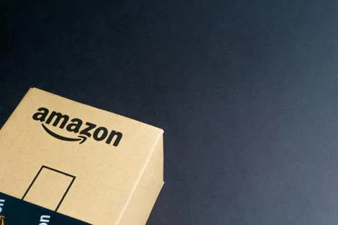 Amazon Prime box or Amazon shipping box on black background 库存照片
