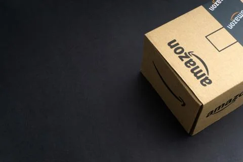 Amazon Prime box or Amazon shipping box on black background Stock Photos