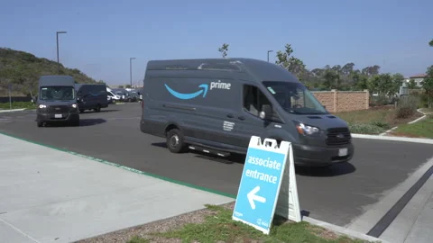Amazon Prime delivery vans pulling out onto street to go on delivery. Stock Footage 160574212