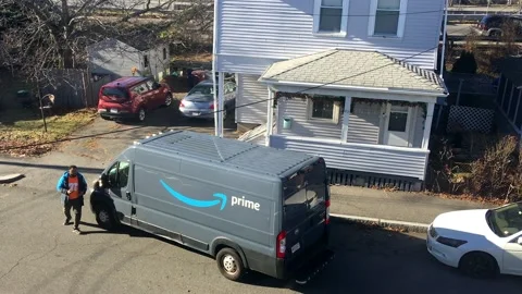 Amazon Prime driver delivers package to house Revere Mass. USA Dec. 21 2023 Stock Footage 261447039