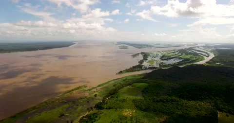 The Amazon River during the rainy season invades the lowland lands around Stock Footage 138178131