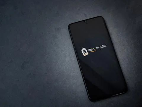 Amazon Seller app launch screen on smartphone on dark marble stone background Stock Photos
