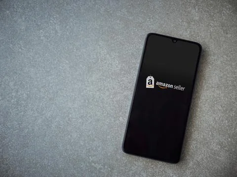 Amazon Seller app launch screen on smartphone on ceramic stone background Foto stock