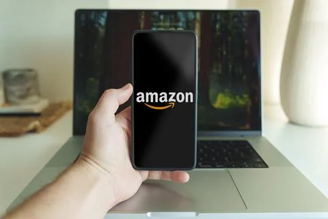 Amazon shopping application logo in front of laptop. High quality photo Stock Photos