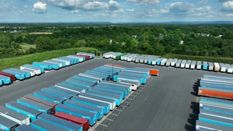 Amazon trailers parked at distribution center. Package delivery service in Stock Footage 205185251