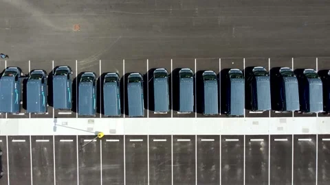 Amazon vans in the parking lot of an Amazon warehouse - aerial drone Stock-Footage 154987257