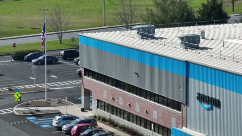 Amazon warehouse with American USA flag. Distribution center for package Stock Footage 239374874