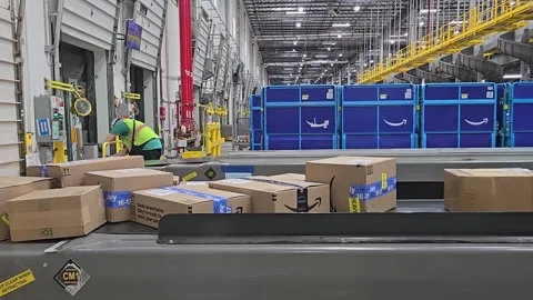Amazon warehouse with packages on conveyor belts Stock Footage 282603977