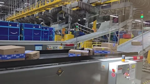 Amazon warehouse with packages on conveyor belts Stock Footage 282603994