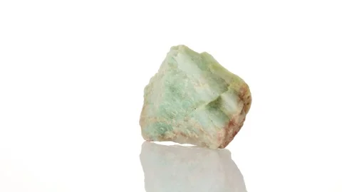 Amazonite mineral stone spinning in a circle on a white background Stock Footage 282776812