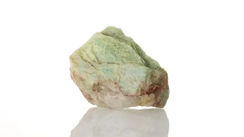 Amazonite mineral stone spinning in a circle on a white background Stock Footage 285076868
