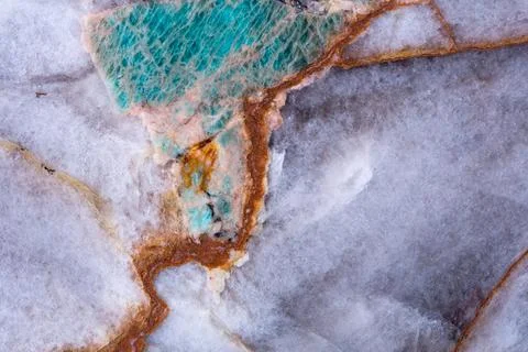 Amazonite quartzite stone texture in clean violet and green tones. Stock Photos