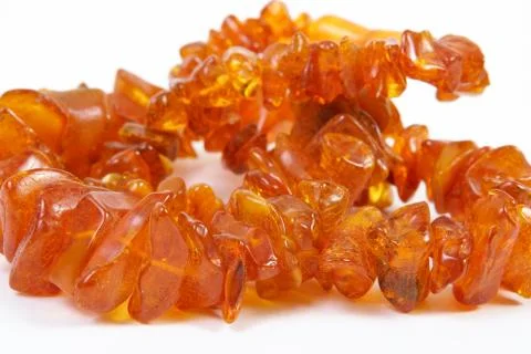 Amber beads  on white background Stock Photos