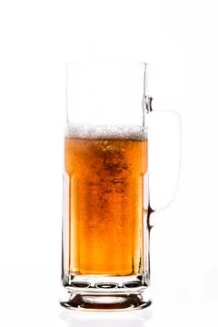 Amber beer being served in jar on white background Foto stock
