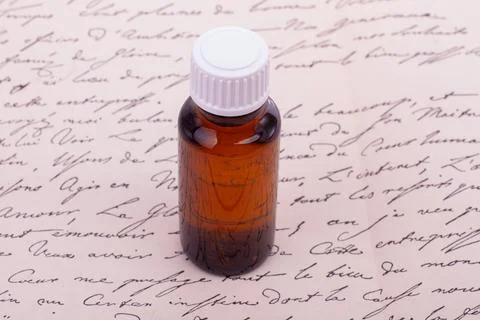 Amber Bottle with Handwritten Script Stock Photos