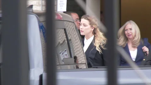 Amber Heard exits courthouse during Johnny Depp defamation trial Stock Footage 196196608
