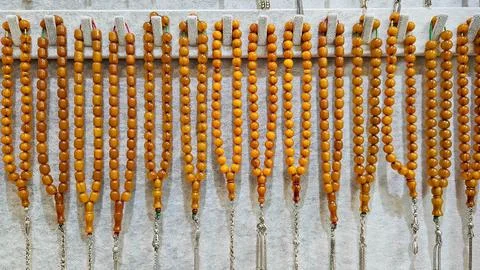 Amber prayer beads display Stock Photos