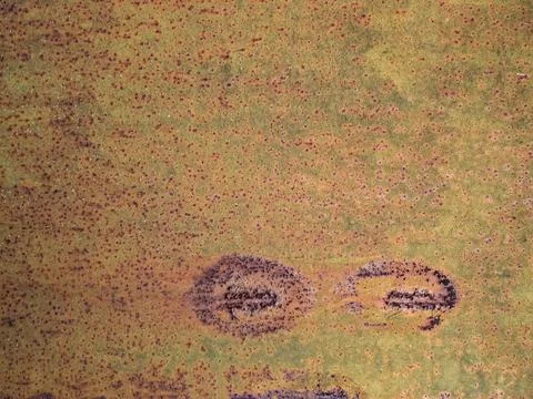 Amber, rusty surface with pinpoint damage. Corrosion of metal with a rough Stock Illustration