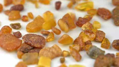 Amber Stones Falling Down and Bouncing Slow Motion Close-up Video stock 150742479