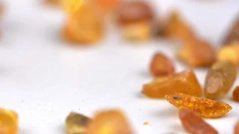 Amber Stones Falling Down and Bouncing Slow Motion Close-up Stock Footage 150742654