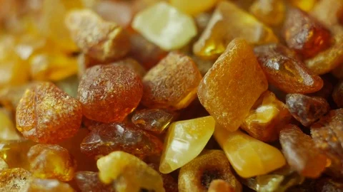 Amber stones on turn table Stock Footage 71467505
