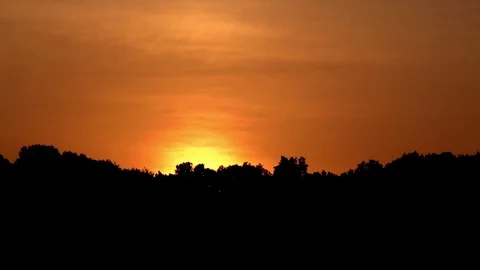 Amber sun rises Stock Footage 98682668