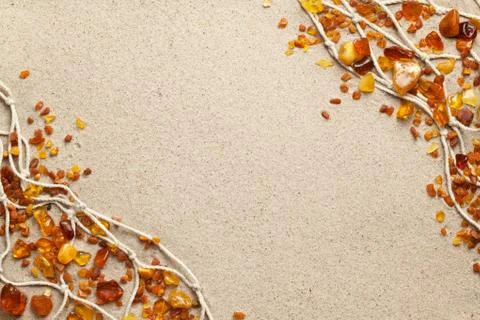 Ambers On Sand Background Stock Photos