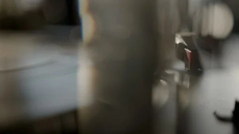 Ambient macro of stylus needle on spinning vinyl record Stock Footage 129574048
