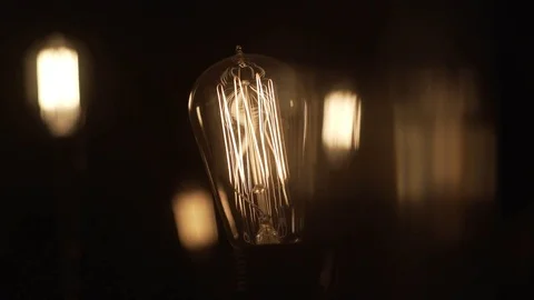 Ambient Pulsing Vintage Edison Light Bulbs On Black Stock Footage
