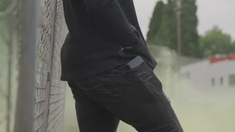 Ambiguous Man Next to Fence Stock Footage 208711228
