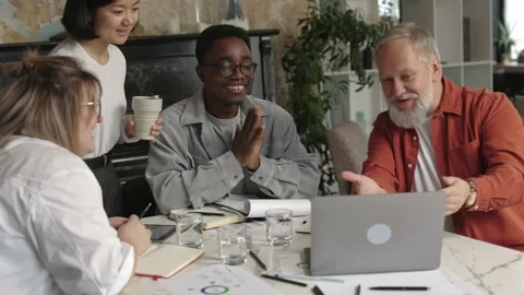 Ambitious and attractive boss interacting with young business team mixed gender Stock Footage 166060869