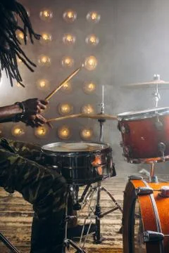 Ambitious guy playing rock at night club Stock Photos