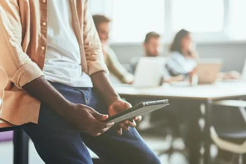 Ambitious learner using tablet in his studying process Stock Photos