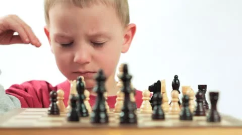 Ambitious little boy playing chess. Stock Footage 8869244