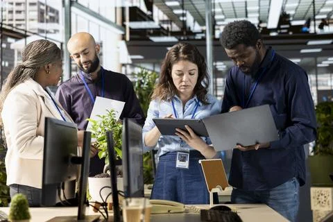 Ambitious work team collaborates on a financial planning project in an office Stock Photos