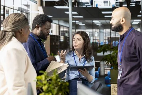 Ambitious work team collaborates on a financial planning project in an office Stock Photos