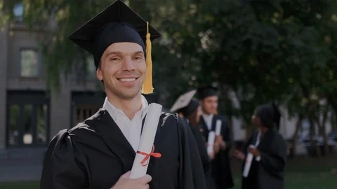 Ambitious young man with high intelligence proud of his diploma at graduation Stock Footage 116177536