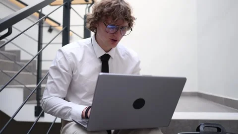 Ambitious young man working on laptop Stock Footage 333974769