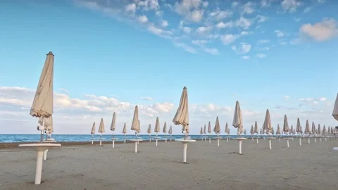 Ambrellas on the empty beach Stock Footage 239729406