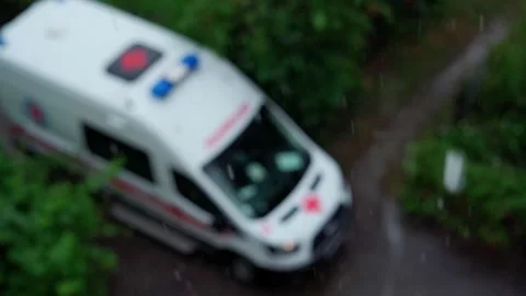Ambulance and rain. Ambulance arrived in bad weather Stock Footage