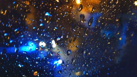 Ambulance car drive rush for help in slow mode while rain in night city 4K Stock Footage 125491407