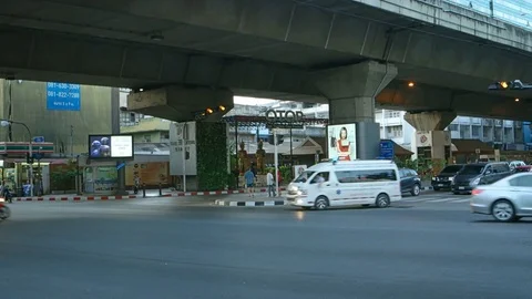 Ambulance crossing through an urban intersection with sirens blaring. Stock Footage 77009016