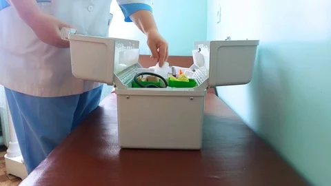 Ambulance doctor opens a box Stock Footage 78374568