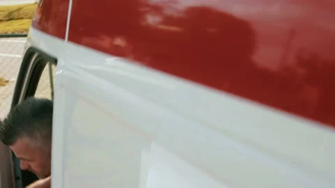 Ambulance driver responding to emergency quickly exiting the van. Stock Footage 211819965