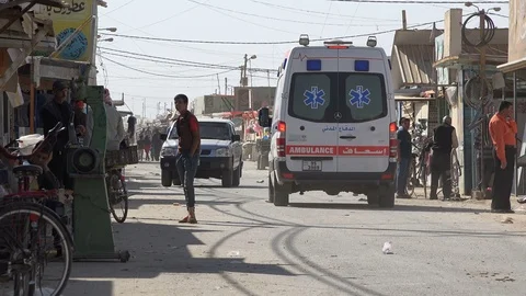 Ambulance drives through Zaatari Syrian refugee camp in Jordan Stock Footage 71530011