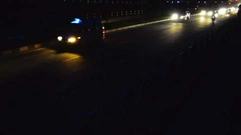 An Ambulance driving alongside a Huge traffic full of vehicles in a highway Stock Footage 248734061