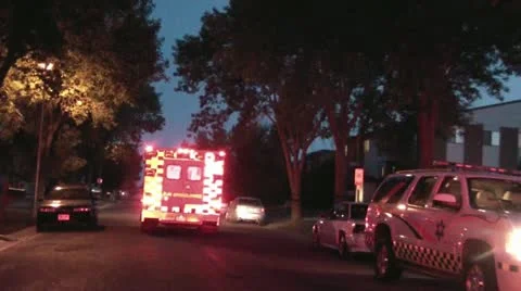Ambulance Driving Away with Lights On Stock Footage