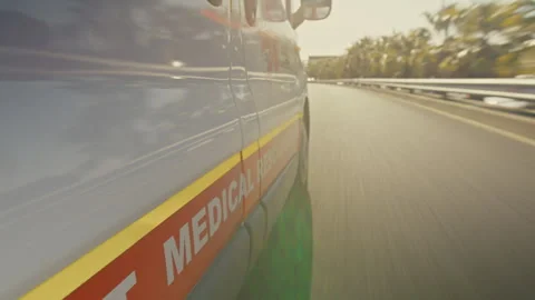 An ambulance driving fast on a highway Stock Footage 278787183