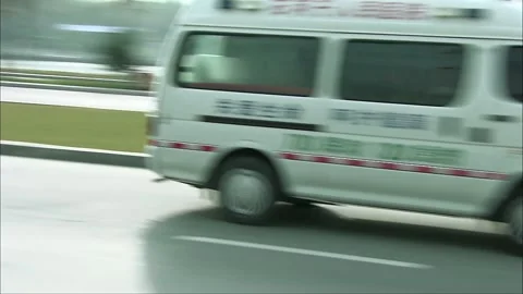 Ambulance driving on the road Stock Footage 252482021