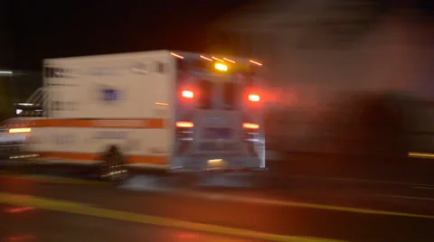 Ambulance With Emergency Lights Transporting Medical Patient To Hospital Stock Footage